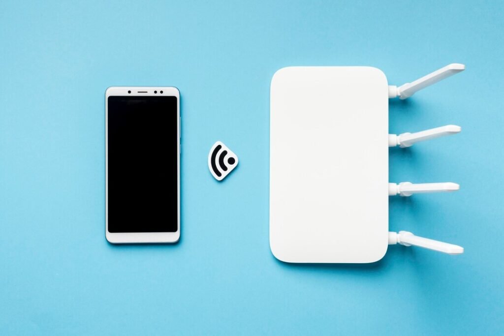 Top view of Wi-Fi router with smartphone