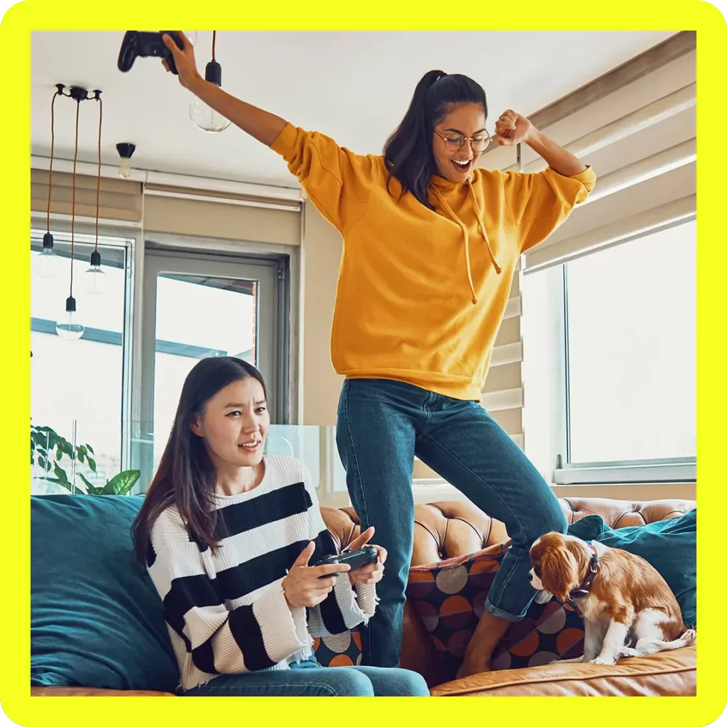 Woman dancing after winning video game