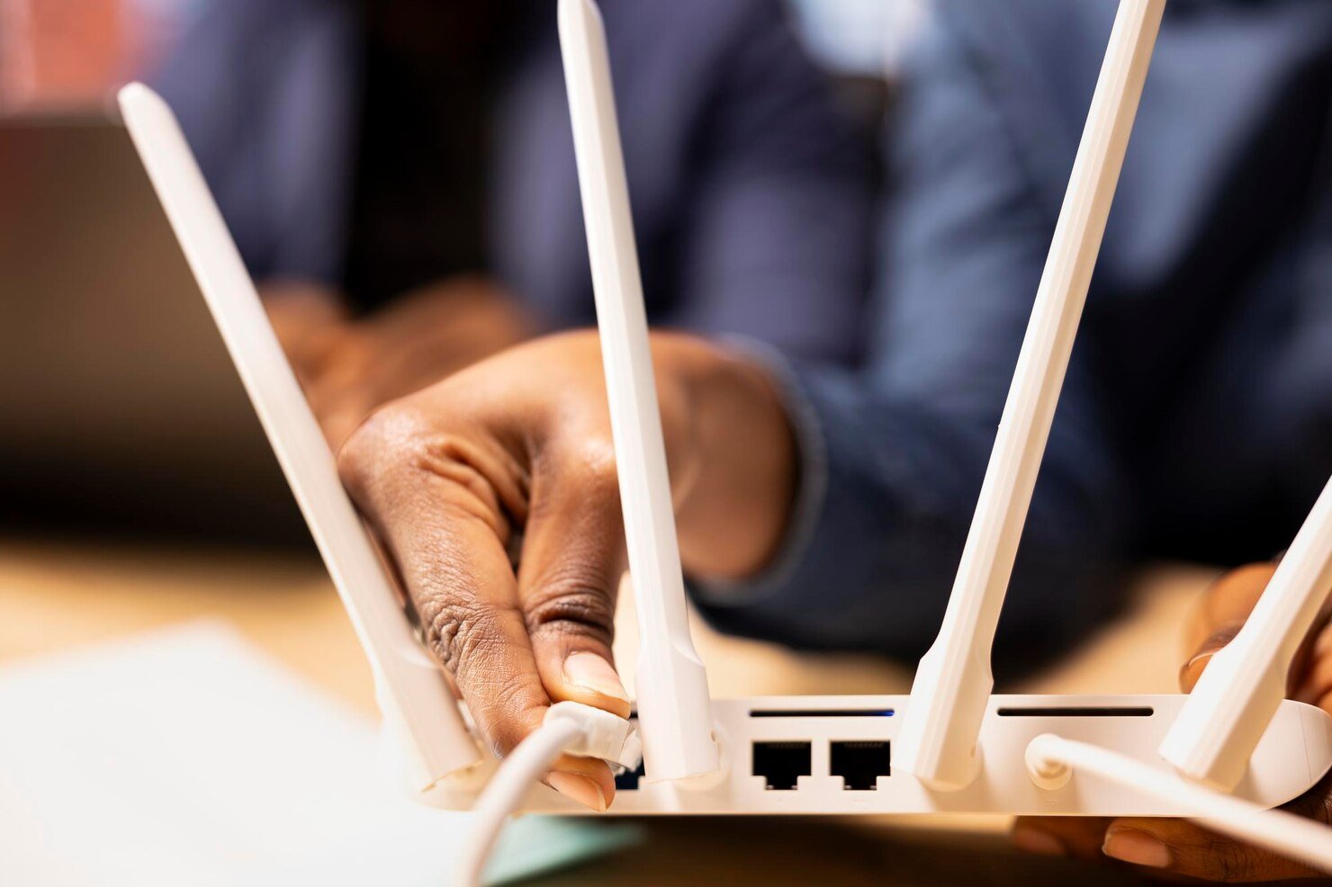 Young woman setting up internet modem
